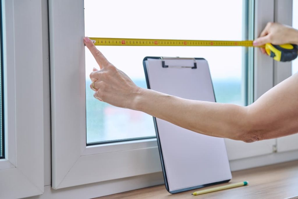 Woman Measuring For Roller Blinds